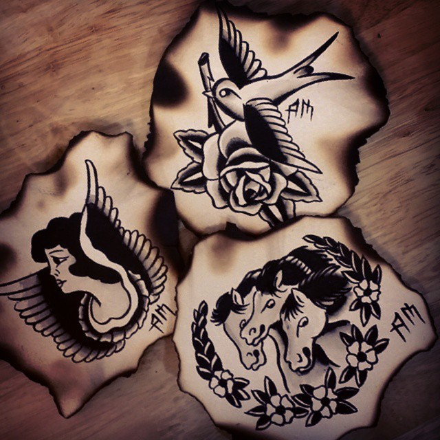 Three traditional black and white tattoo designs — hummingbird with rose, winged female profile, and horse head with flowers